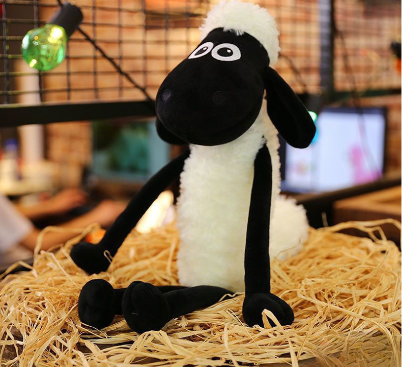 Shaun Sheep Plush on a Bed