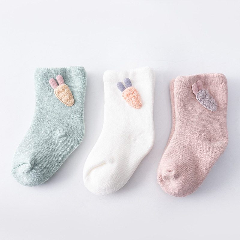 Children's socks in towel tube image