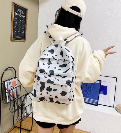 Cow print canvas bag in use