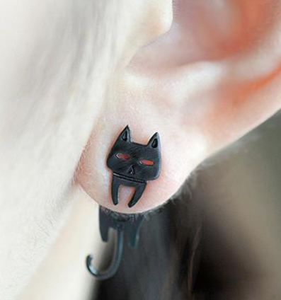Close-up of Cat and Fish Stud Earrings