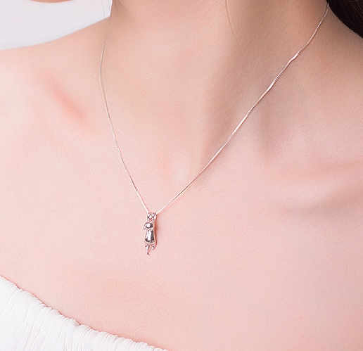 Close-up of cat pendant