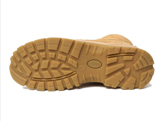 Safety boot outsole detail — deep-lug rubber grip pattern
