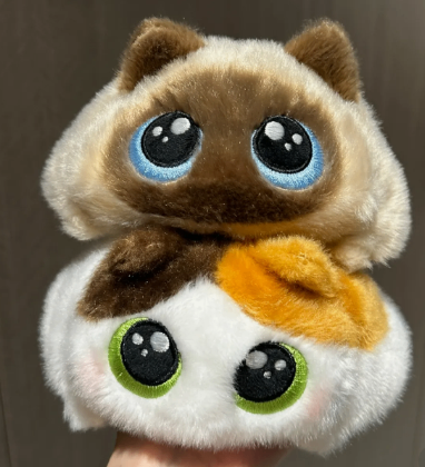 Chubby, squishy cat plush toy with round eyes, perfect for emotional support, stress relief, and healing. image